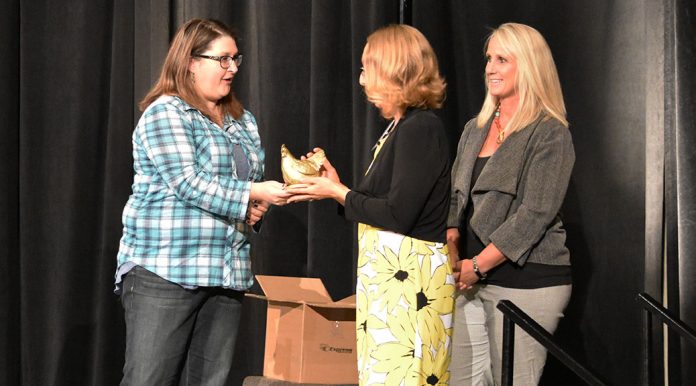 Sanford Aberdeen’s Angie Herrick, center, receives a HEN 2.0 award from Sheena Thomas, left, and Nancy McDonald.Hen Award