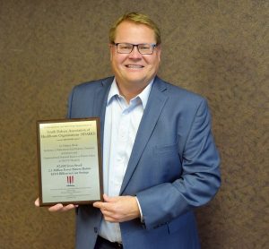 South Dakota Association of Healthcare Organizations President/CEO Scott A. Duke displays a HEN 2.0 award presented to SDAHO at the CMS Quality Conference in December 2016.