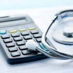 Stethoscope and calculator symbol for health care costs