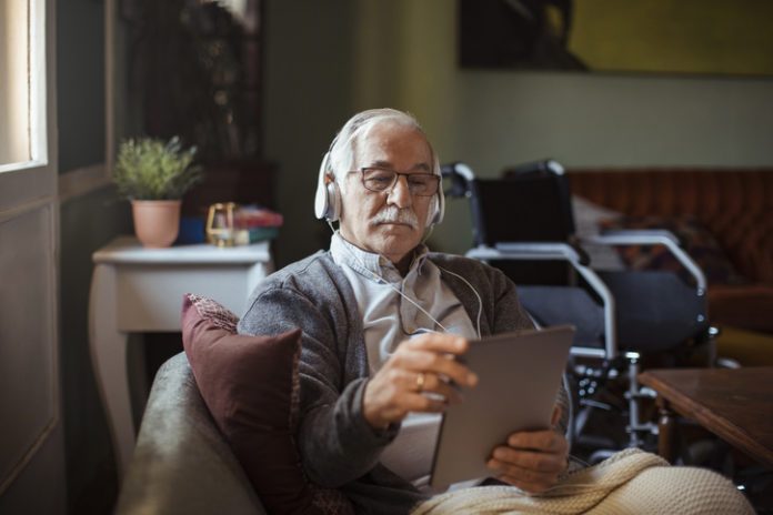 Senior Man using a Tablet at Home