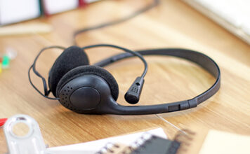 Headset with microphone sitting on desk