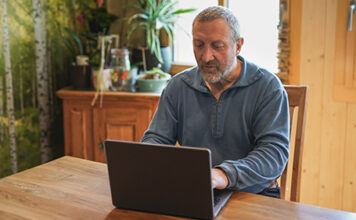 Man learning through SDAHO's online educational opportunities